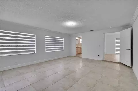 Living - 453 W 40th Pl, Hialeah, FL 33012 photo 9 of 9