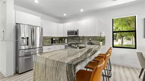 Kitchen - 8877 W 35th Ave, Hialeah, FL 33018 photo 2 of 2