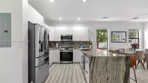 Kitchen - 8877 W 35th Ave, Hialeah, FL 33018 photo 1 of 2