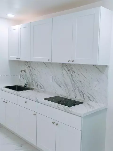 Kitchen - 730 Curtiss Dr, Opa Locka, FL 33054 photo 3 of 4