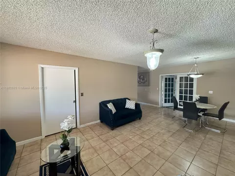 Living - 275 E 34th St, Hialeah, FL 33013 photo 3 of 4