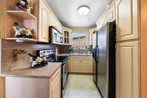 Kitchen - 897 W 36th St, Hialeah, FL 33012 photo 1 of 2