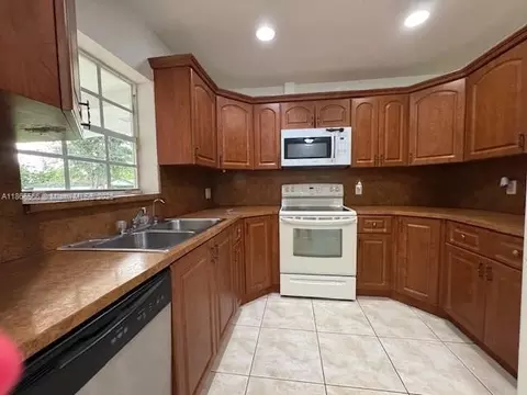 Kitchen - 105 E 55th St, Hialeah, FL 33013 photo 1 of 2