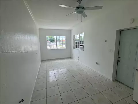 Living - 105 E 55th St, Hialeah, FL 33013 photo 3 of 3