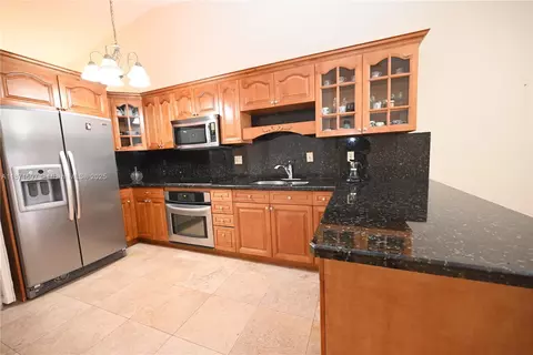 Kitchen - 5870 W 20th Ln, Hialeah, FL 33016 photo 2 of 3