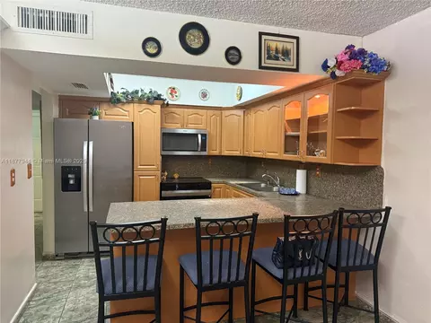 Kitchen - 7174 W 2nd Ln, Hialeah, FL 33014 photo 2 of 3