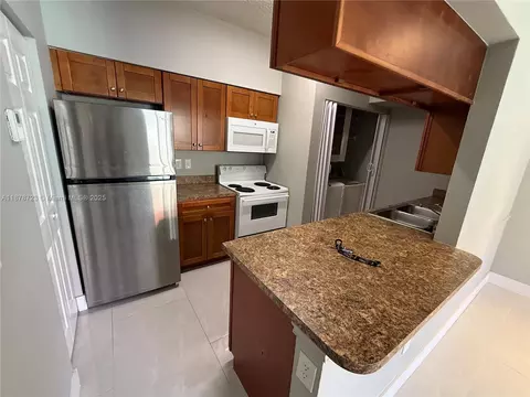 Kitchen - 18332 NW 68th Ave #A, Hialeah, FL 33015 photo 2 of 5