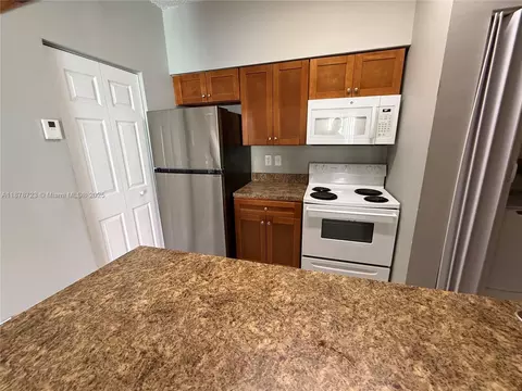 Kitchen - 18332 NW 68th Ave #A, Hialeah, FL 33015 photo 1 of 5