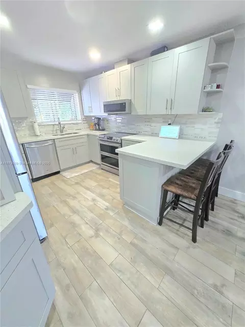Kitchen - 19710 Cypress Ct, Hialeah, FL 33015 photo 2 of 4