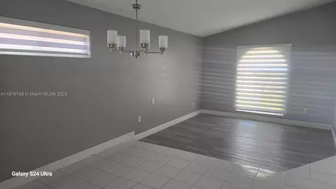Living - 3240 W 76th Pl, Hialeah, FL 33018 photo 2 of 2