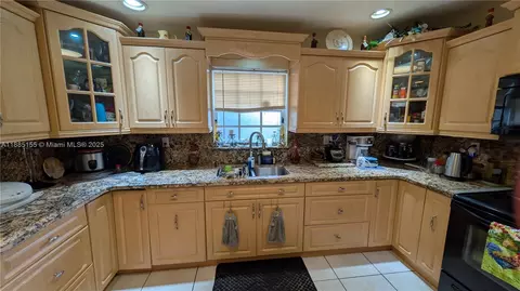 Kitchen - 900 W 50th Pl, Hialeah, FL 33012 photo 3 of 3