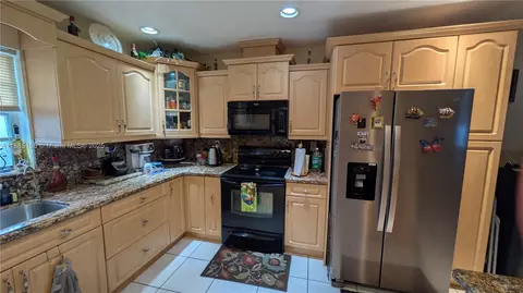 Kitchen - 900 W 50th Pl, Hialeah, FL 33012 photo 2 of 3