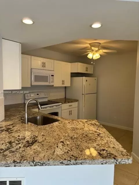 8977 Wiles Rd #103, Coral Springs, FL 33067