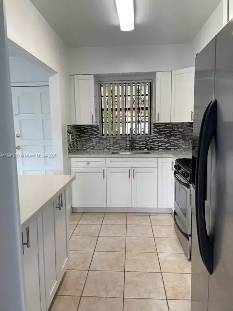 Kitchen - 3831 W 4th Ct, Hialeah, FL 33012 photo 3 of 3