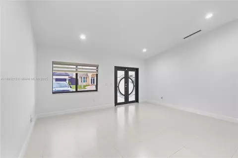 Living - 9182 NW 148th St, Miami Lakes, FL 33018 photo 3 of 7