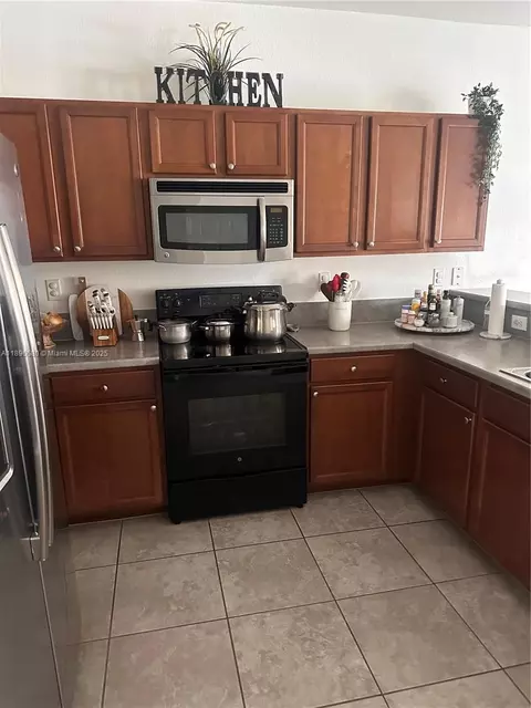 Kitchen - 8867 W 35th Way, Hialeah, FL 33018 photo 2 of 2