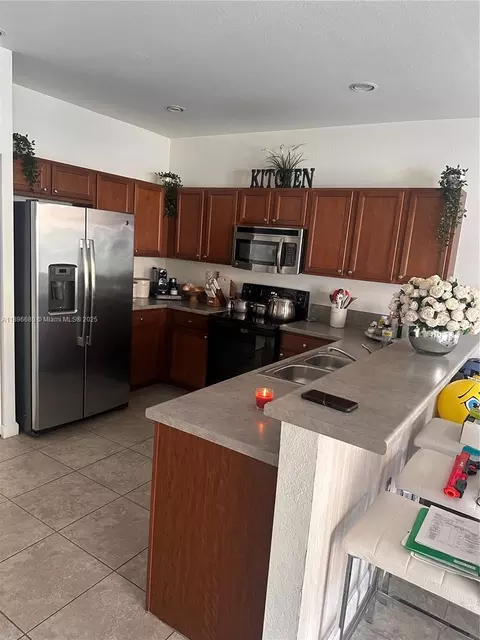 Kitchen - 8867 W 35th Way, Hialeah, FL 33018 photo 1 of 2