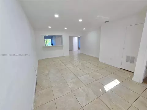 Living - 7770 W 8th Ave, Hialeah, FL 33014 photo 2 of 4