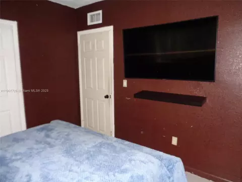 Bedroom - 385 E 56th St, Hialeah, FL 33013 photo 4 of 11