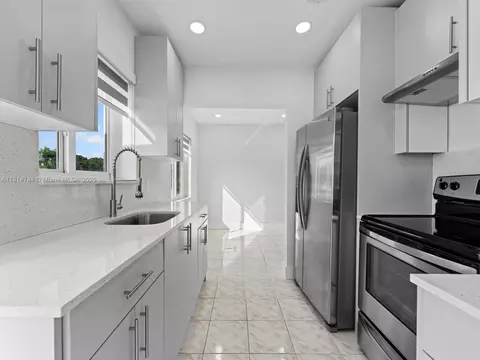 Kitchen - 104 E 58th St, Hialeah, FL 33013 photo 3 of 4