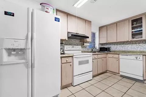 Kitchen - 911 E 9th Pl, Hialeah, FL 33010 photo 2 of 3