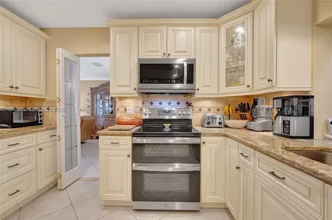 Kitchen - 230 SE 4th St, Dania Beach, FL 33004 photo 2 of 13