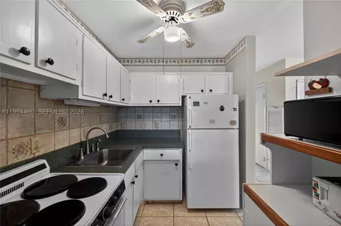 Kitchen - 331 E Mcnab Rd #226, Pompano Beach, FL 33060 photo 3 of 3