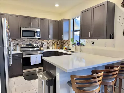 Kitchen - 11032 W 33rd Way, Hialeah, FL 33018 photo 1 of 3