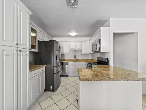Kitchen - 655 W 70th Pl, Hialeah, FL 33014 photo 3 of 4