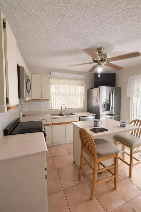 Kitchen - 19804 NW 67th Ct, Hialeah, FL 33015 photo 1 of 2