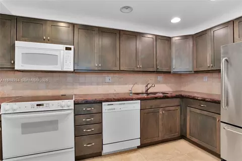 Kitchen - 145 SE 25th Rd #602, Miami, FL 33129 photo 1 of 2