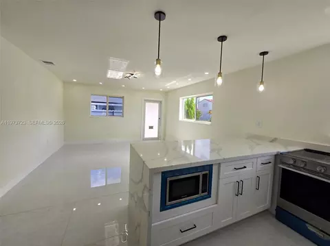 Living - 571 E 54th St, Hialeah, FL 33013 photo 3 of 5
