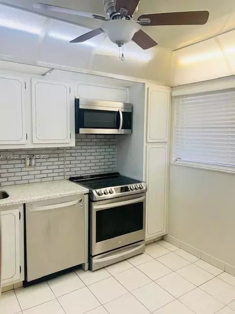 Kitchen - 3251 Holiday Springs Blvd #403, Margate, FL 33063 photo 2 of 2