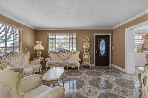 Living - 380 E 56th St, Hialeah, FL 33013 photo 1 of 2