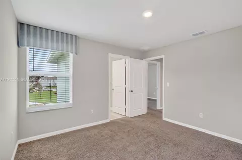 Bedroom - 5610 SEdgewater Cir, Stuart, FL 34997 photo 7 of 9
