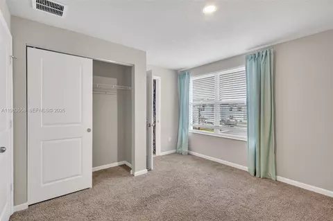 Bedroom - 5610 SEdgewater Cir, Stuart, FL 34997 photo 8 of 9