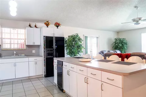 Kitchen - 661 NE 4th Pl, Hialeah, FL 33010 photo 2 of 2