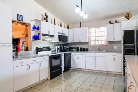 Kitchen - 661 NE 4th Pl, Hialeah, FL 33010 photo 1 of 2
