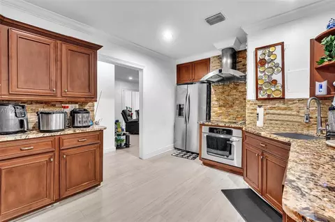 Kitchen - 340 W 55th St, Hialeah, FL 33012 photo 2 of 2