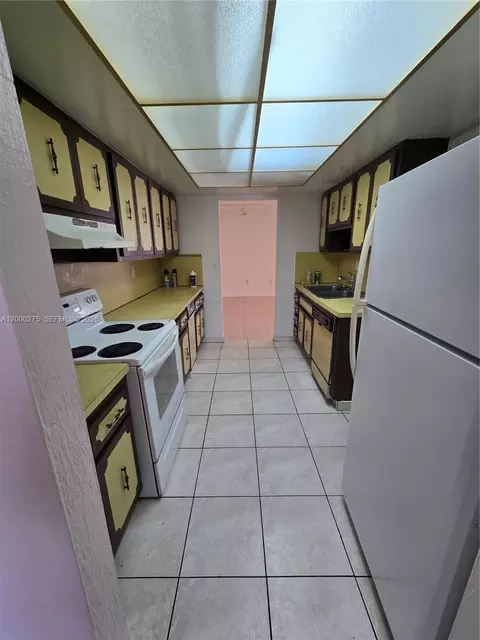 Kitchen - 932 W 80th Pl, Hialeah, FL 33014 photo 1 of 2
