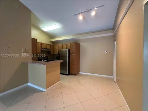 Living - 731 Lyons Rd #16203, Coconut Creek, FL 33063 photo 2 of 4