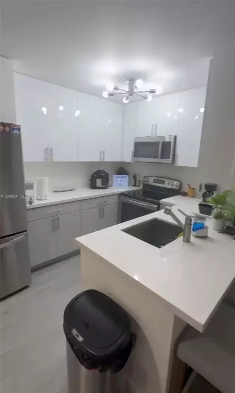 Kitchen - 931 Lyons Rd #4101, Coconut Creek, FL 33063 photo 2 of 3