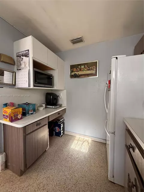 Kitchen - 399 W 12th St, Hialeah, FL 33010 photo 2 of 2