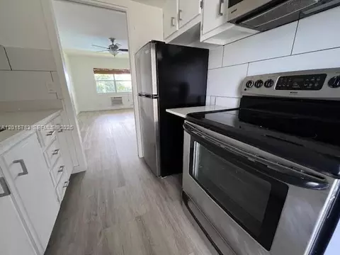 Kitchen - 1350 E Sample Rd #306, Pompano Beach, FL 33064 photo 3 of 3