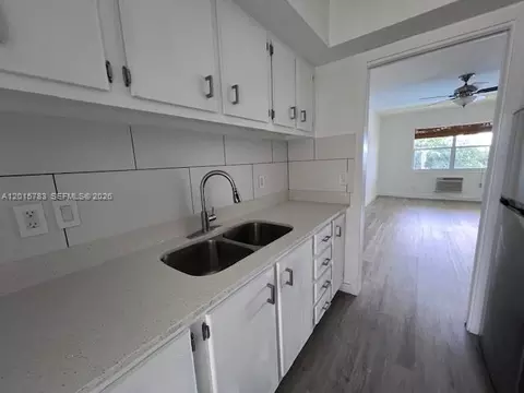 Kitchen - 1350 E Sample Rd #306, Pompano Beach, FL 33064 photo 2 of 3
