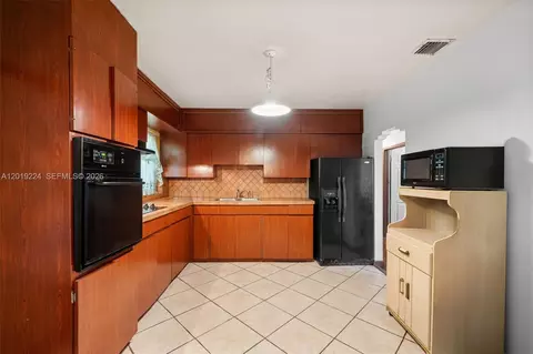 Kitchen - 511 Dunad Ave, Opa Locka, FL 33054 photo 2 of 3