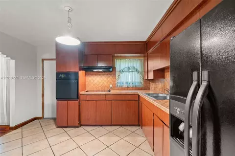 Kitchen - 511 Dunad Ave, Opa Locka, FL 33054 photo 3 of 3