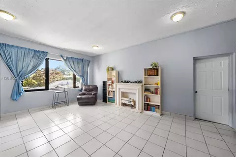 Living - 511 Dunad Ave, Opa Locka, FL 33054 photo 7 of 9
