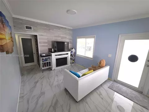 Living - 651 E 48th St, Hialeah, FL 33013 photo 2 of 3
