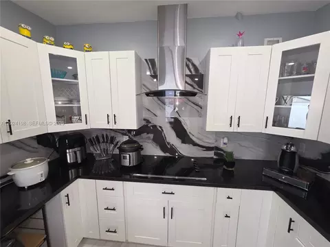Kitchen - 651 E 48th St, Hialeah, FL 33013 photo 4 of 7